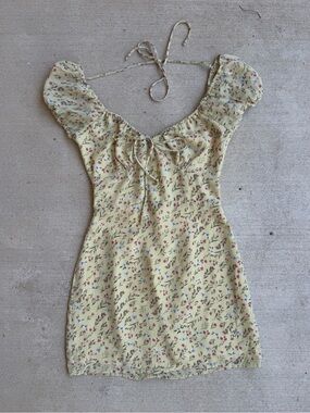 Kittenish Floral Mini Dress with tie details and baby sleeves